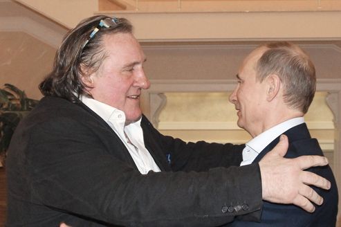 Russian President Vladimir Putin greets French actor Gerard Depardieu during their meeting in Sochi